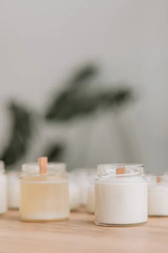 Hand-carved intention candles on a wooden table